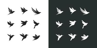 Set of flying birds sign logo vector silhouettes