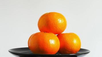 Fresh oranges rotate over white background video