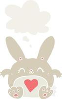 cute cartoon rabbit with love heart and thought bubble in retro style vector