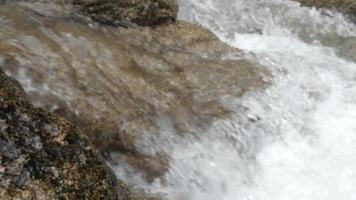 water flowing into the rocks video