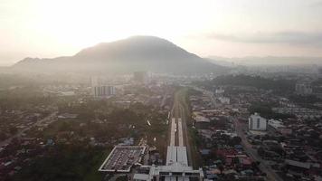 Train leaving the Bukit Mertajam KTM station in early morning. video