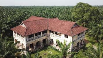 A century old colonial building 99 doors mansion in oil palm estate. video