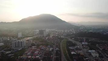 Aerial of train on railway tracks near the town Bukit Mertajam. video