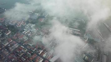 Aerial view morning fog surrounds George Town World Heritage. video