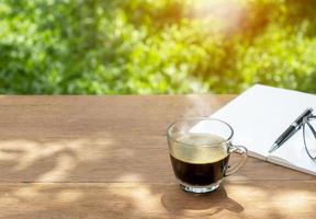 cup of coffee on table, morning concept photo