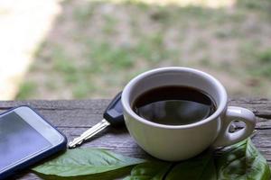 cup of coffee on wooden table. photo