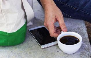 Hand holding cup of coffee photo