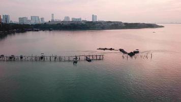 Aerial fisherman boat arrive the Jelutong pier. video