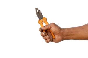 The hand of the mechanic is holding a yellow plier photo