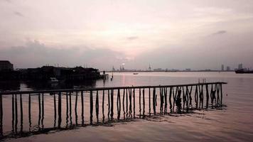 Fly toward the bridge by local clan jetty at Tan Jetty, Georgetown. video