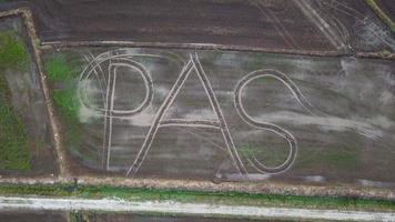 Aerial view PAS word at the paddy field at Penang, Malaysia. video