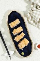 Top View Aburi Sake Mentai Roll with Cheese in Blue Oval Long Plate photo