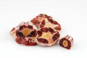 Raw Uncooked Beef Oxtail Portion Isolated on White Background photo