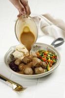 Delicious Homemade Swedish Meatballs Kottbullar with Mushroom Cream Sauce, Boiled Mix Vegetable, and Lingonberry Jam photo