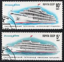 Postage stamp printed in the Soviet Union in 1987. The river passenger ship Maksim Gorky and Alexander Pushkin. photo