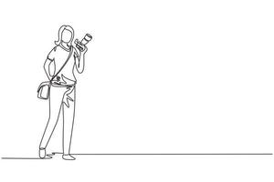 Single one line drawing woman paparazzi or journalist occupation, standing with digital camera and sling bag. Professional photographer taking pictures. Continuous line draw design vector illustration