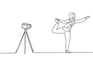 Single continuous line drawing Arab woman blogger in hijab sportswear shoots video on camera doing exercises at home. Fitness vlogger live broadcast of training session. One line draw design vector