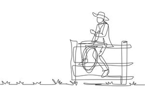 Single continuous line drawing American cowboy with lasso rope on wild west sunset landscape in the evening. Cowboy lifestyle in the stables. Dynamic one line draw graphic design vector illustration