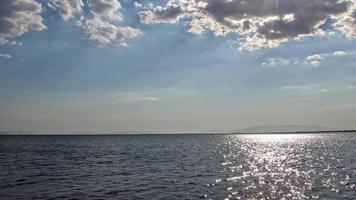 Summer Clouds In Blue Sky And Sparkling Ocean Waves Footage. video