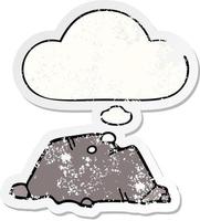 cartoon rock and thought bubble as a distressed worn sticker vector