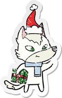 friendly distressed sticker cartoon of a christmas wolf wearing santa hat vector