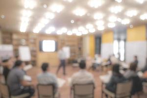 Blurry Asian people sit in round for meeting and share experience. photo