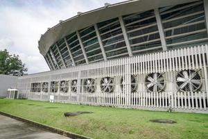 a lot of big Air Compressors in the row, of large convention hall. photo