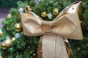 christmas gold theme decoration with bow and gift box. photo