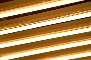 luxury gold fluorescent light line pattern backround decorate ceiling at some place in Thailand. photo