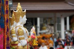 Great white Buddha statue with flag background. photo