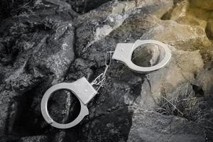 handcuffs on rocks photo