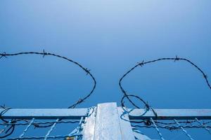 Barbed wire at a gate photo