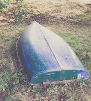 Upside-down old wooden boat photo