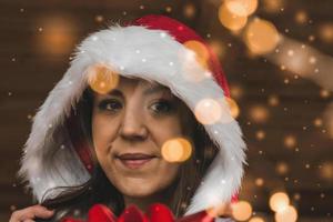 Close-up face portrait of cute girl in Santa cape photo