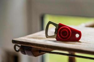 a bottle opener on a rustic table photo