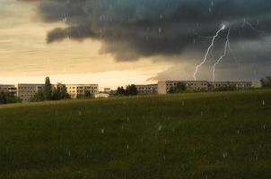 Lightening strike during an urban thunderstorm photo