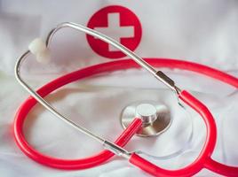 red stethoscope on a lab coat II photo