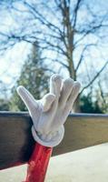 Glove on wooden bench photo