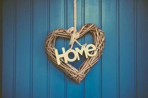 a heart decoration on a wooden wall photo