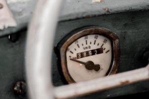 Old rusty speedometer and odometer on a car photo