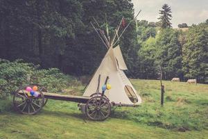 an Indian tent with a horse trailer photo