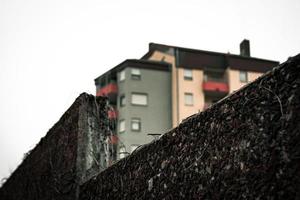 houses with a stone wall in the foreground photo