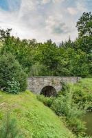 Stone bridge in city park photo