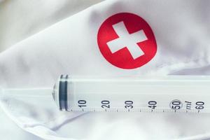 syringe with red cross photo