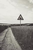 dirt road with train road sign photo