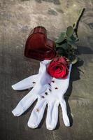 Valentines concept with red rose , heart and glove photo