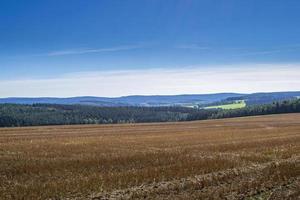 a harvested field in autumn photo