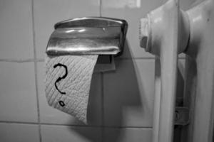 Toilet paper with hand drawn question mark photo