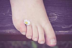 Barefoot with flower photo