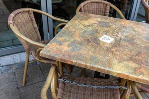 locked chairs in a city as a result of the corona virus photo
